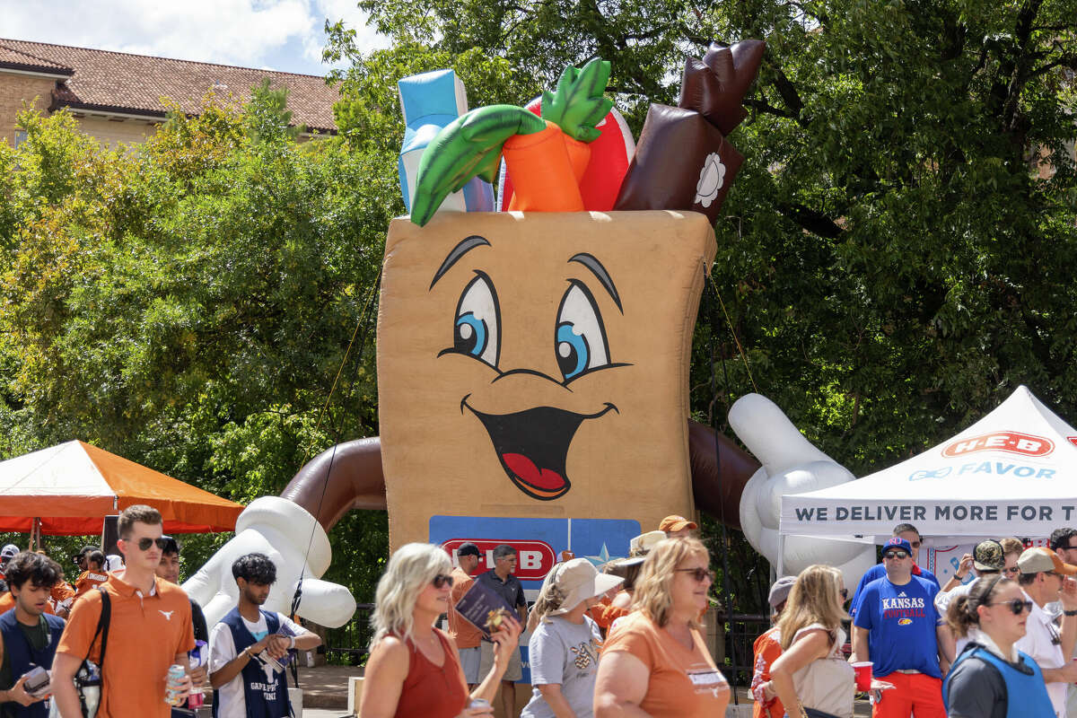 AUSTIN, TX - SEPTEMBER 30: HEB Buddy stands tall above the fans walking along Bevo Blvd before the Big 12 football game between Texas Longhorns and Kansas Jayhawks on September 30, 2023, at Darrell K Royal-Texas Memorial Stadium in Austin, TX. (Photo by David Buono/Icon Sportswire via Getty Images)