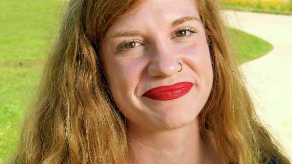 Molly Cook poses for a portrait just outside of downtown with I-45 in the background on Thursday, April 13, 2023 in Houston. Cook is an organizer with Stop TxDOT I-45, a local group established to oppose the freeway’s expansion.