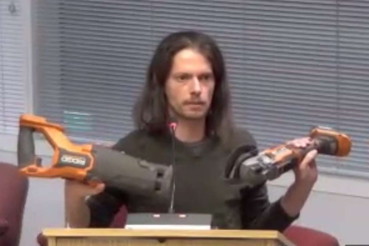 To protest Stamford approving speed cameras, man holds up power tools at Board of Reps meeting