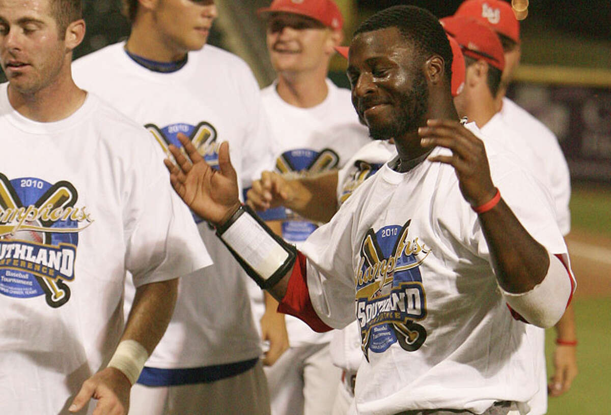 Lamar Cardinals Anthony Moore tries on his 2010 Southland Conference Tournament championship t-shirt after the Cardinals take the championship 17 to 7 over the Texas States Bobcats at Whataburger Field in Corpus Christi, Texas.