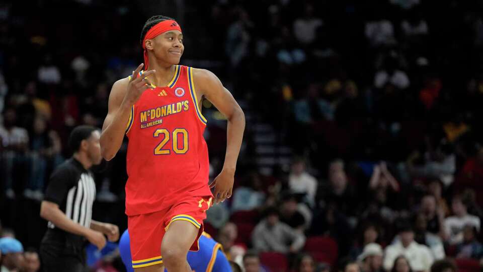 West guard Tre Johnson (20) celebrates his three-pointer during the second half of the boys 2024 McDonald’s All American game at Toyota Center on Tuesday, April 2, 2024, in Houston.