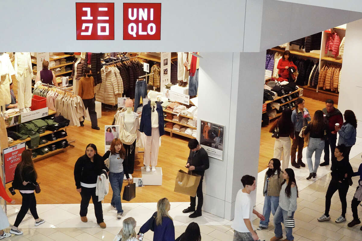 Shoppers walk at a Uniqlo store in the Glendale Galleria shopping mall on the day after Christmas on December 26, 2023 in Glendale, California. 