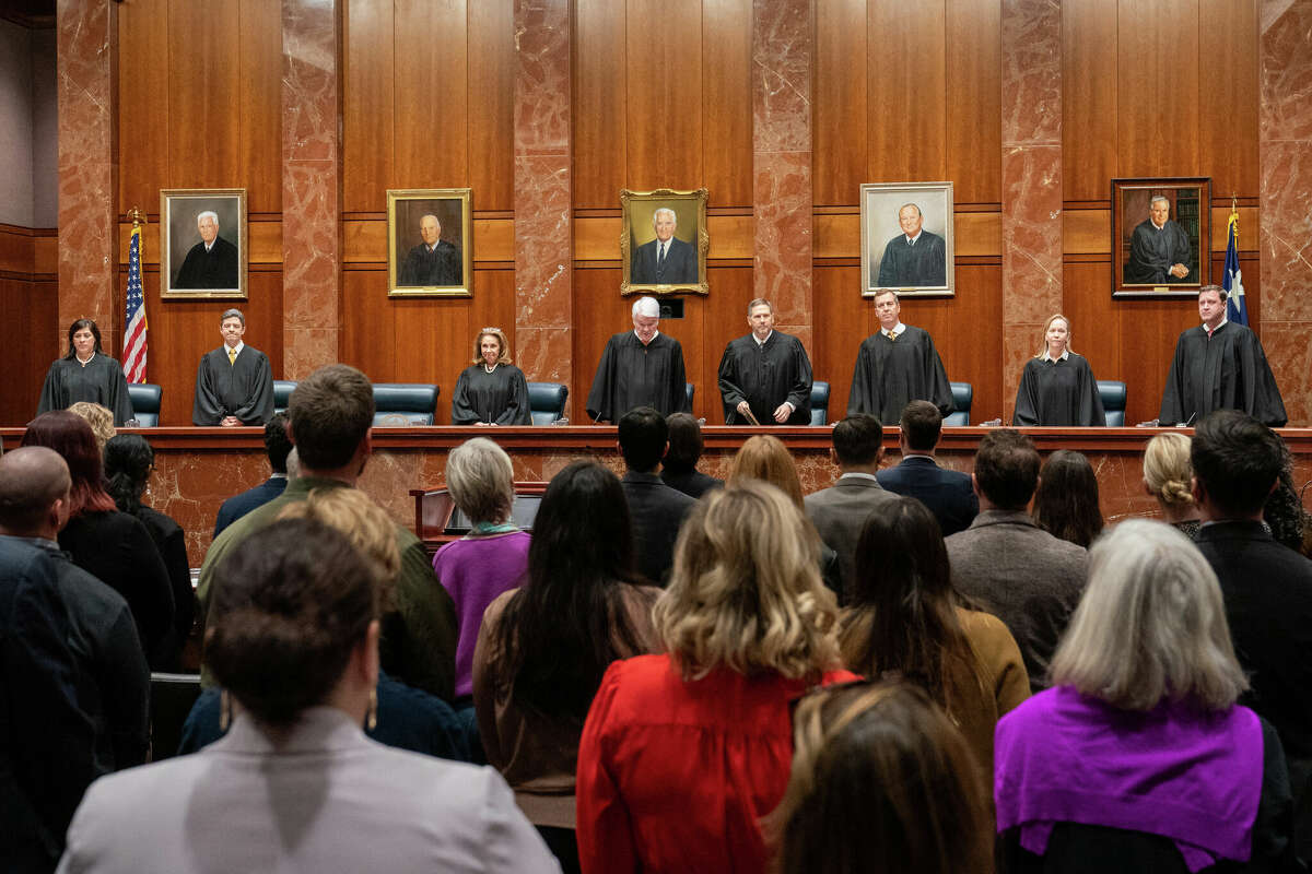 (L-R) Justice Rebeca Aizpuru Huddle, Justice Brett Busby, Justice Debra Lehrmann, Chief Justice Nathan L. Hecht, Justice Jeff Boyd, Justice Jimmy Blacklock, Justice Jane Bland, and Justice Evan A. Young, of the Texas Supreme Court, arrive to hear litigators make their arguments in Zurowski v. State of Texas, at the Texas Supreme Court in Austin, Texas, on November 28, 2023. The Texas Supreme Court heard arguments Tuesday in a case brought on behalf of 22 women who were denied abortions even though they had serious complications with their pregnancies that were in some cases life-threatening. (Photo by SUZANNE CORDEIRO / AFP) (Photo by SUZANNE CORDEIRO/AFP via Getty Images)