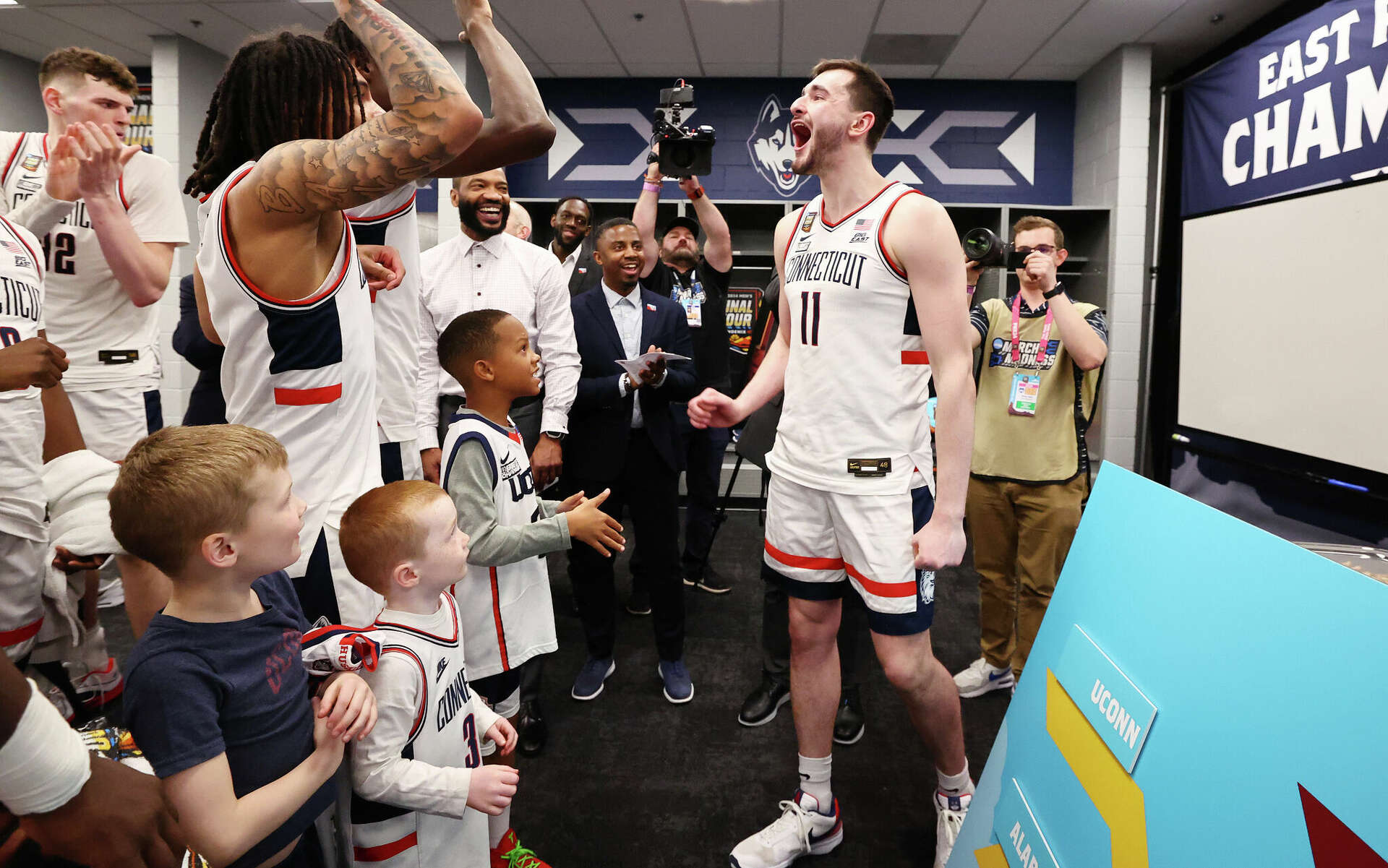 Children of UConn coaches are constant presence in Husky locker room