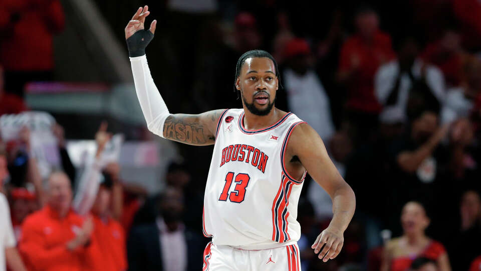 Houston forward J'Wan Roberts (13) rousts the crowd after scoring against Kansas during the first half of their Big 12 baskeball game held at the Fertitta Center Saturday, Mar. 9, 2024 in Houston.