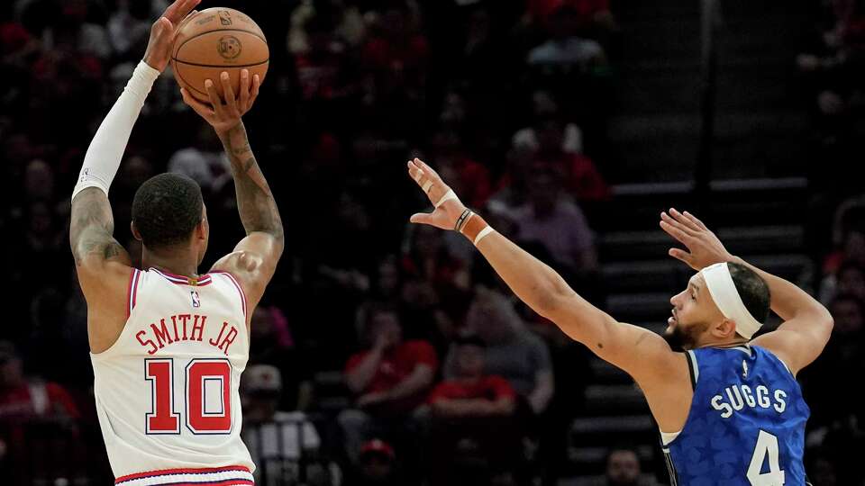 Houston Rockets forward Jabari Smith Jr. (10) aims for the basket while Orlando Magic guard Jalen Suggs (4) is trying to stop him during the fourth quarter of a NBA game Tuesday, April 9, 2024 at Toyota Center in Houston. The Houston Rockets defeated the Orlando Magic 118-106 in the final home game.