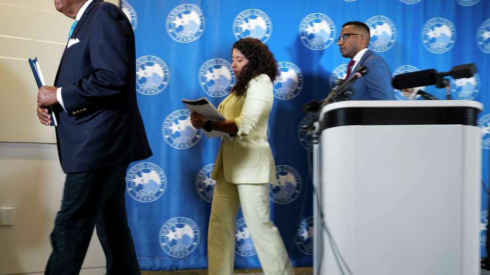 Harris County Commissioner Precinct 1 Rodney Ellis, from left, Harris County Judge Lina Hidalgo and Harris County Attorney Christian Menefee leave the podium after giving response to Texas Attorney General Ken Paxton’s lawsuit challenging the Uplift Harris program, the guaranteed income program, in a press conference Wednesday, April 10, 2024 at Harris County Administration Building in Houston. Harris County officials called the lawsuit by Paxton a targeted act.