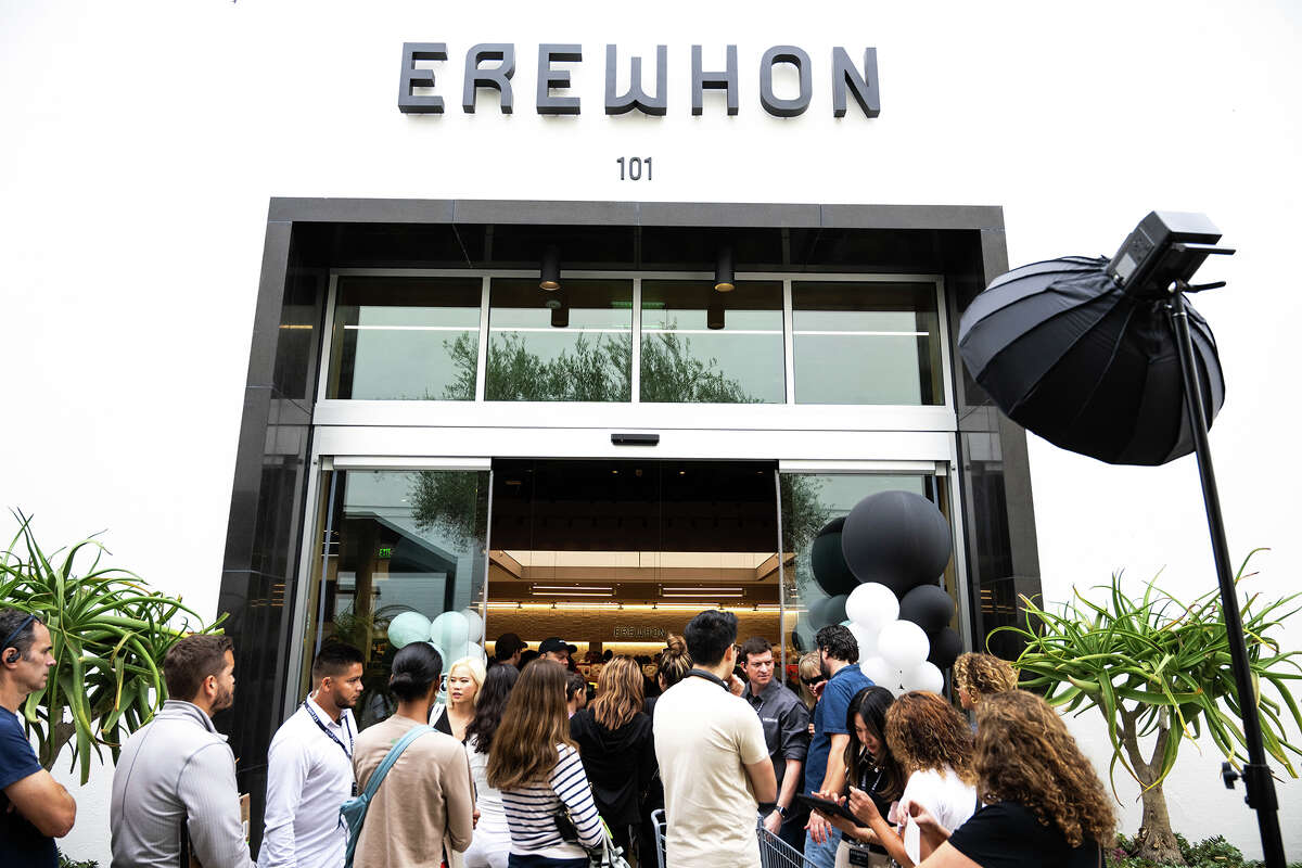 People come and go at the high-end grocery store Erewhon during their Pasadena opening on Wednesday, September 13, 2023.