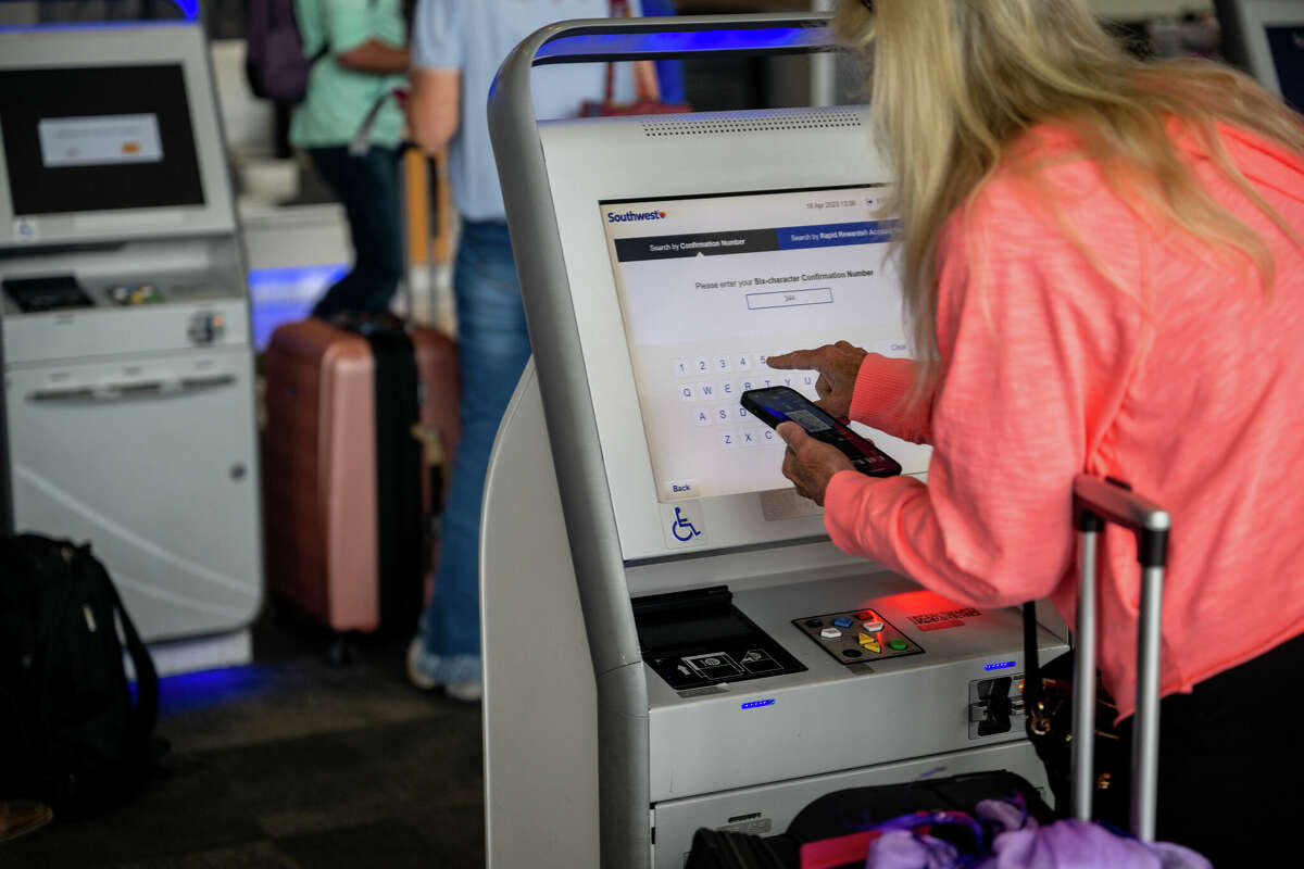 A passenger checks-in for their flight at the Austin-Bergstrom International Airport on April 18, 2023 in Austin, Texas. 