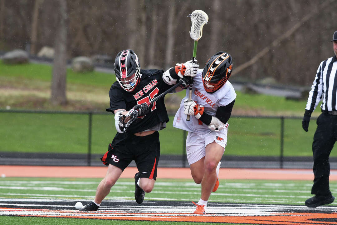 New Canaan boys lacrosse defeats Ridgefield in FCIAC matchup