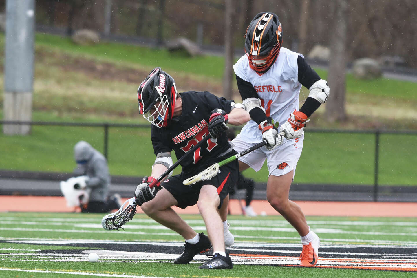 New Canaan boys lacrosse defeats Ridgefield in FCIAC matchup