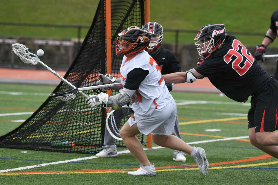 New Canaan boys lacrosse defeats Ridgefield in FCIAC matchup