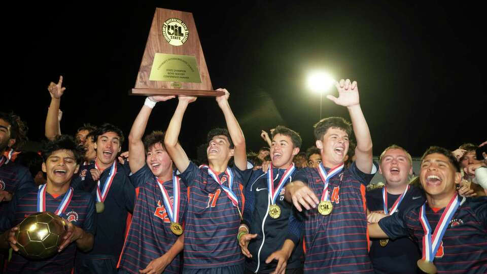 Seven Lakes players celebrate a 2-1 victory over Lewisville Flower Mound in the UIL boys 6A soccer final at Georgetown's Birkelbach Stadium on Saturday.