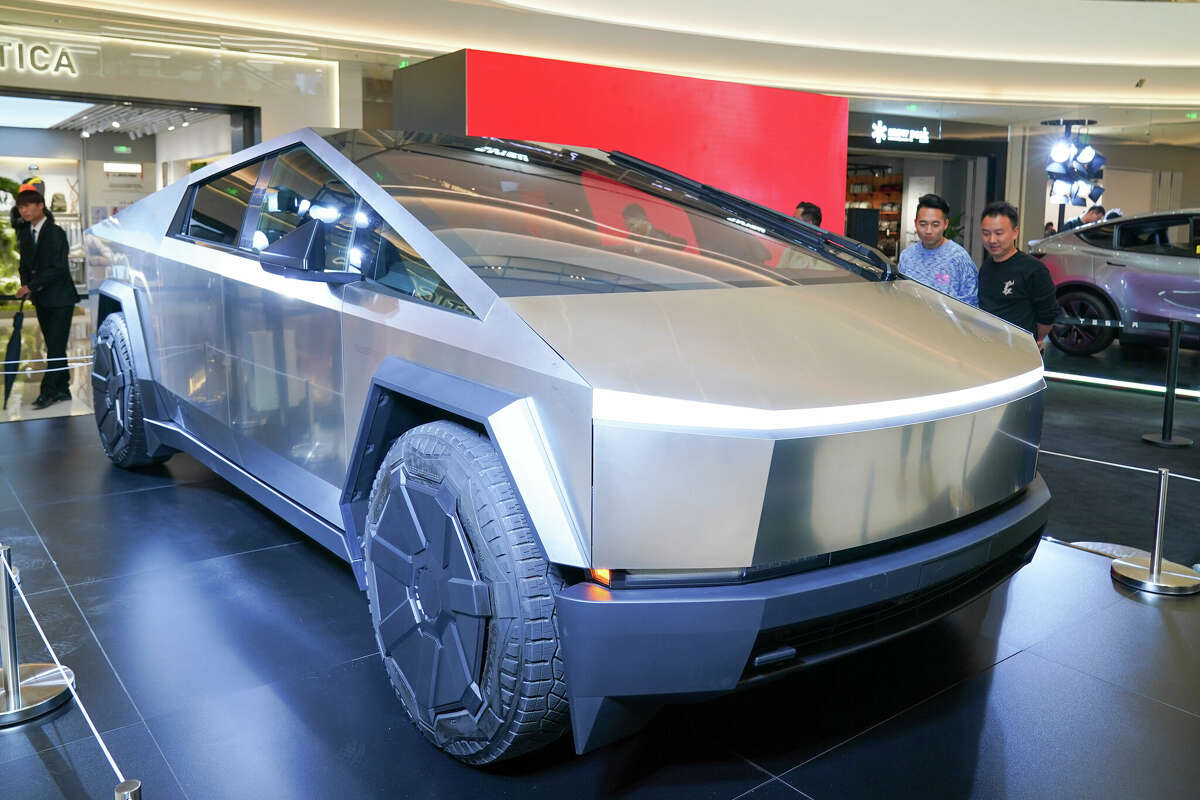 People view a Tesla Cybertruck at a shopping complex on March 6, 2024 in Kunming, Yunnan Province of China. 