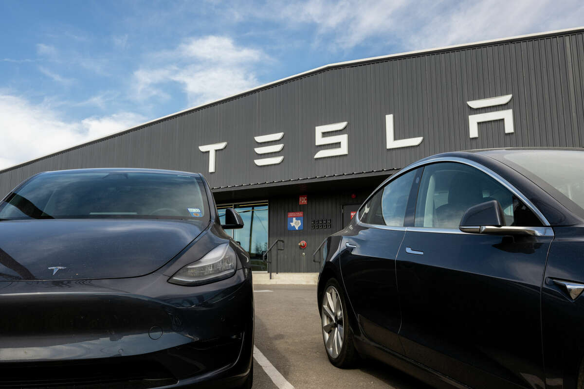 Tesla cars are seen on a lot at a Tesla dealership on January 03, 2023 in Austin, Texas. 