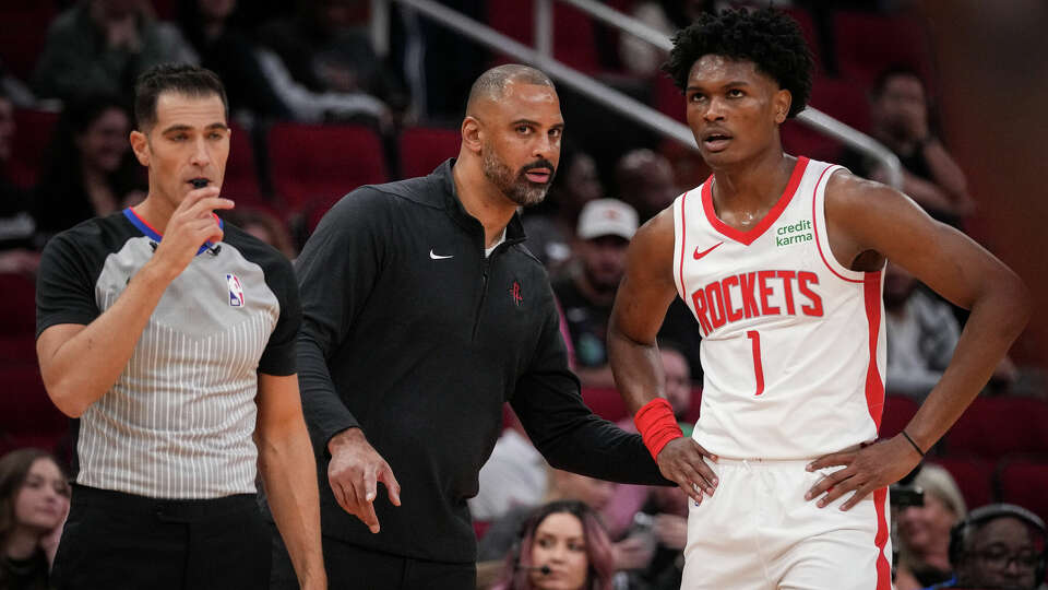 Houston Rockets head coach Ime Udoka talks with forward Amen Thompson on Tuesday, Oct. 10, 2023, at the Toyota Center in Houston.