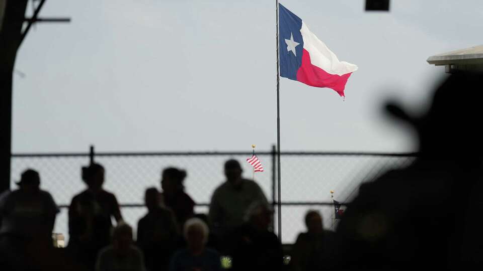 Spectators watch the market steer competition during the at the Montgomery County Fair on Tuesday, April 16, 2024 in Conroe.