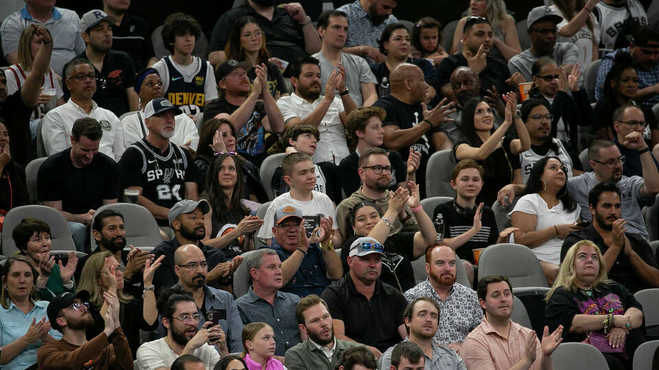 Fans cheer after the San Antonio Spurs score during the first half of their NBA game with the Denver Nuggets at the Frost Bank Center on Friday, April 12, 2024 in San Antonio. Spurs won 121-120.