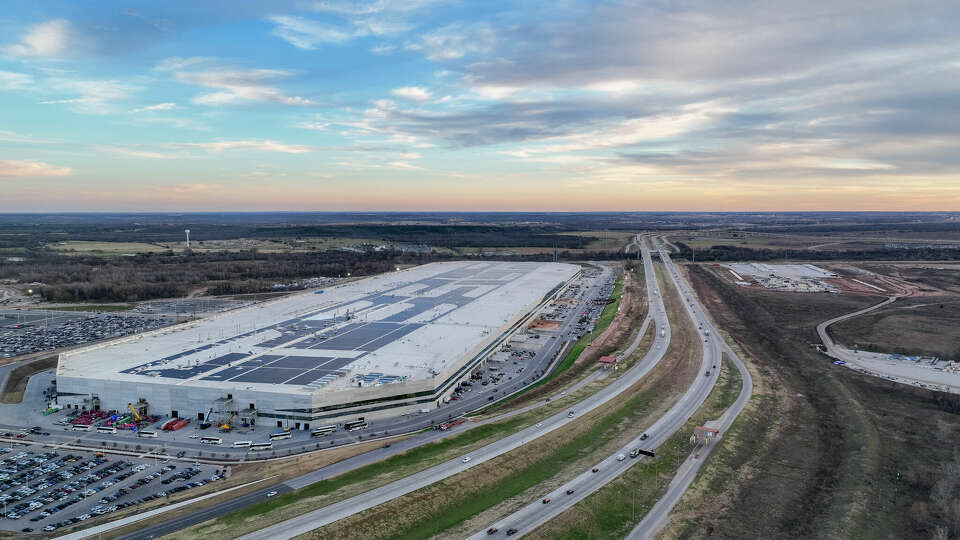 In an aerial view, the Tesla Corporate Headquarters is seen on January 03, 2023 in Travis County, Texas. Tesla's quarterly earnings fell short of Wall Street's expectations and its 2022 delivery target, losing approximately $675 billion in market valuation. CEO Elon Musk suggested that 2022's economic interest rates hurt vehicle demand. 