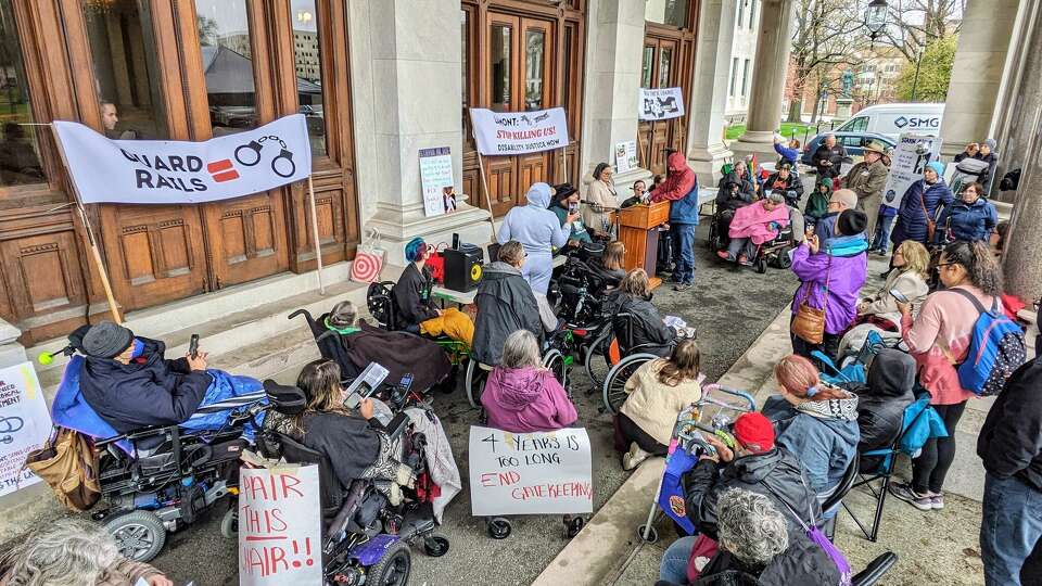 Corey 'Pheez' Lee performs March On during a Disability Rights and Justice Rally to show support for four bills geared to improving services for people with disabilities at the Capitol Building in Hartford on Thursday.