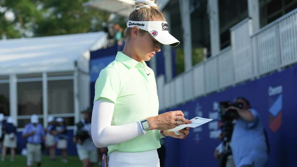 Nelly Korda checks her score card as she finishes the first round of LPGA's The Chevron Championship at Carlton Woods on Thursday, April 18, 2024 in The Woodlands. Korda had six birdies to share second place.