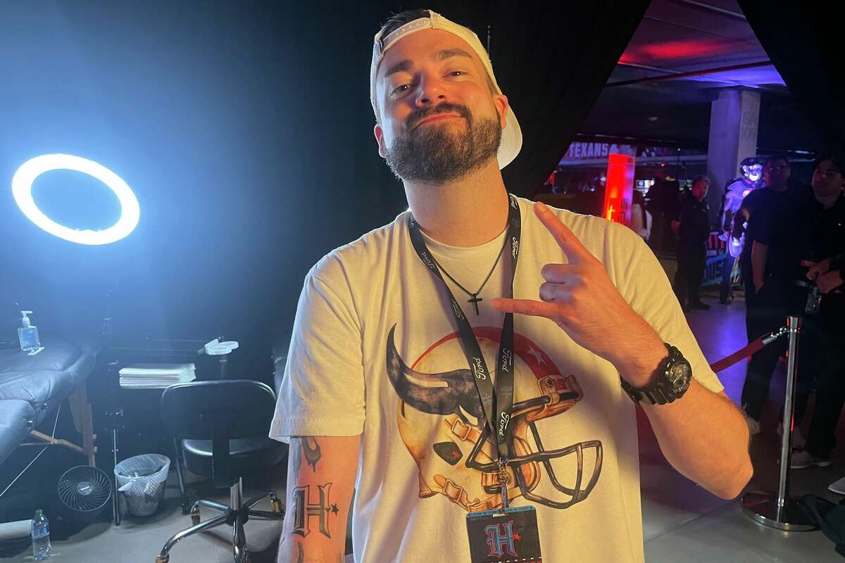 SportsRadio 610 producer Tyler Milner was among the Houston Texans fans to receive a free tattoo during Tuesday's uniform release party at 713 Music Hall.