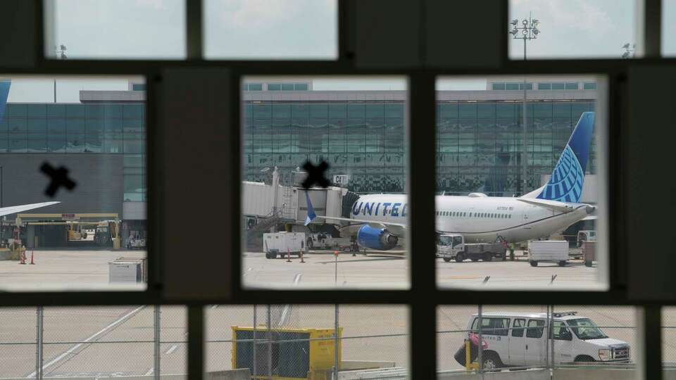 A view of Terminal E is shown through a feature wall that will display LED lighting in the new Terminal D West Pier that is under construction at George Bush Intercontinental Airport Wednesday, April 24, 2024, in Houston. The Terminal D West Pier will provide additional gates.