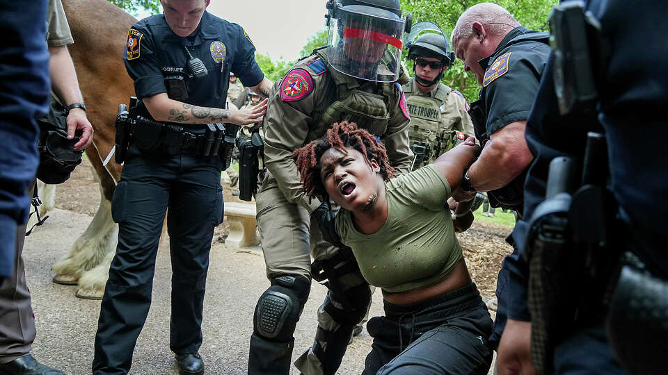 A demonstrator is arrested at a pro-Palestinian protest at the University of Texas, Wednesday, April 24, 2024, in Austin, Texas. (Ricardo B. Brazziell/Austin American-Statesman via AP)