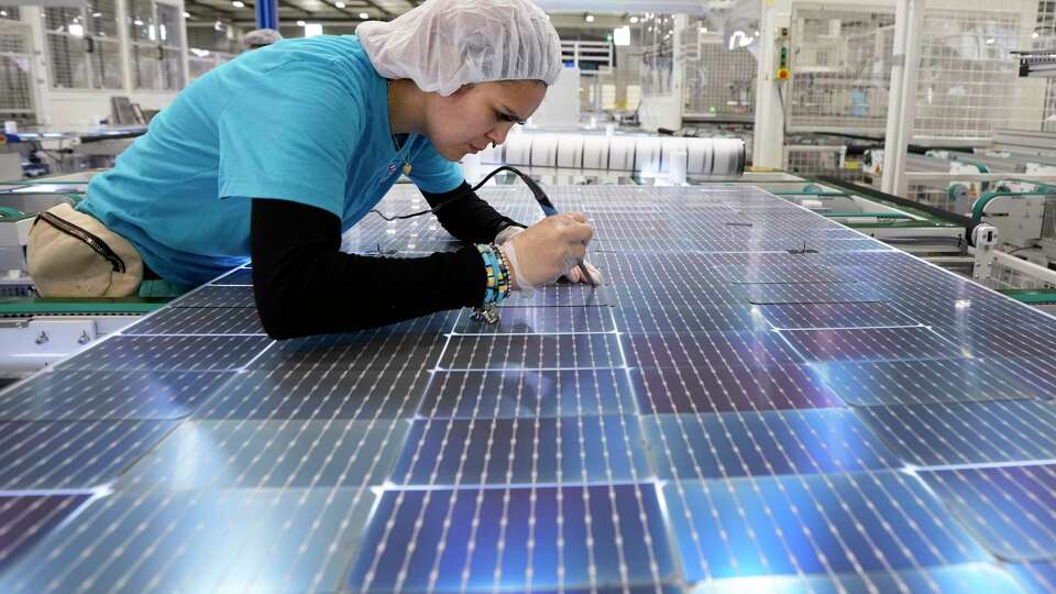 Joana Picazo solders solar cells at a repair station at Elin Energy's solar panel manufacturing facility on Thursday, April 25, 2024 in Brookshire. Elin Energy, a Turkish manufacturer of solar photovoltaic panels, officially opened its first U.S. factory in Brookshire, Texas in April 2024. The company is beginning by making residential solar panels branded as Sirius PV and currently has the ability to manufacture 1,000 megawatts annually at the Texas complex, with plans to scale up to 2,000 megawatts. The 225,000 square foot manufacturing facility is owned and managed by Houston-based real estate firm The Welcome Group and was built by Houston-based construction company KDW Design Build.