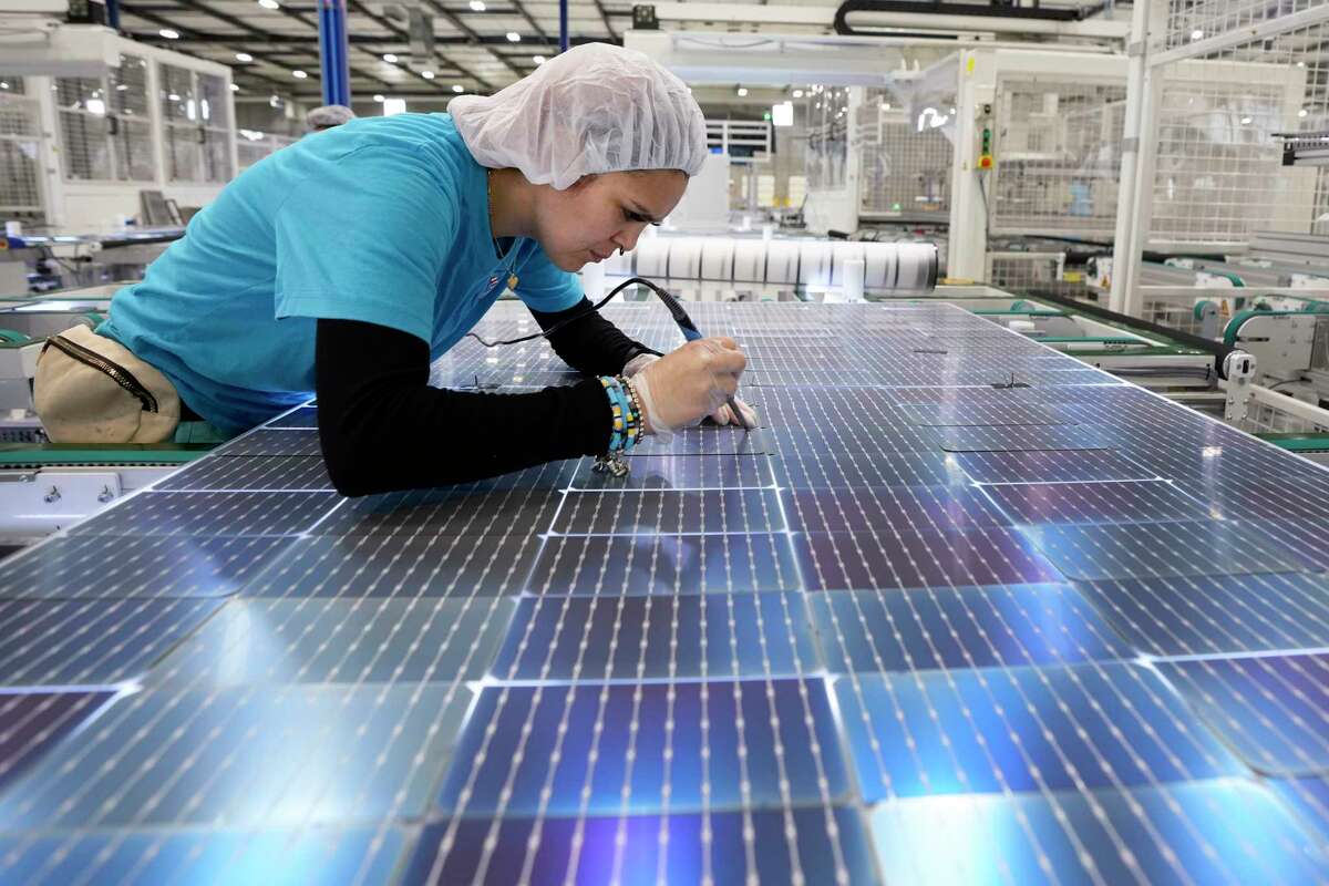 Joana Picazo solders solar cells at a repair station at Elin Energy's solar panel manufacturing facility on Thursday, April 25, 2024 in Brookshire. Elin Energy, a Turkish manufacturer of solar photovoltaic panels, officially opened its first U.S. factory in Brookshire, Texas in April 2024. The company is beginning by making residential solar panels branded as Sirius PV and currently has the ability to manufacture 1,000 megawatts annually at the Texas complex, with plans to scale up to 2,000 megawatts. The 225,000 square foot manufacturing facility is owned and managed by Houston-based real estate firm The Welcome Group and was built by Houston-based construction company KDW Design Build.