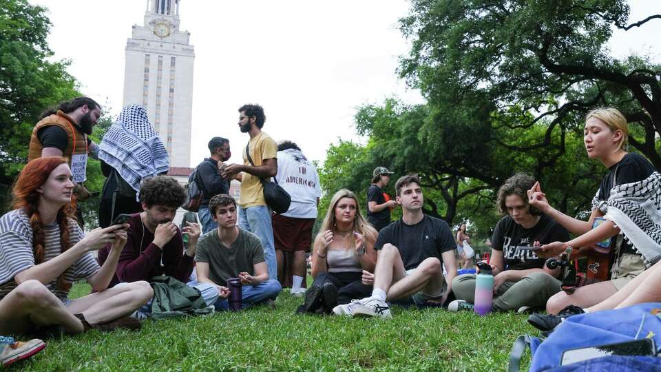 Demonstrators against the war in Gaza sing on the campus of the University of Texas at Austin, Thursday, April 25, 2024, in Austin. Students walked out of class on Wednesday as protests over Gaza continue to sweep college campuses around the country.