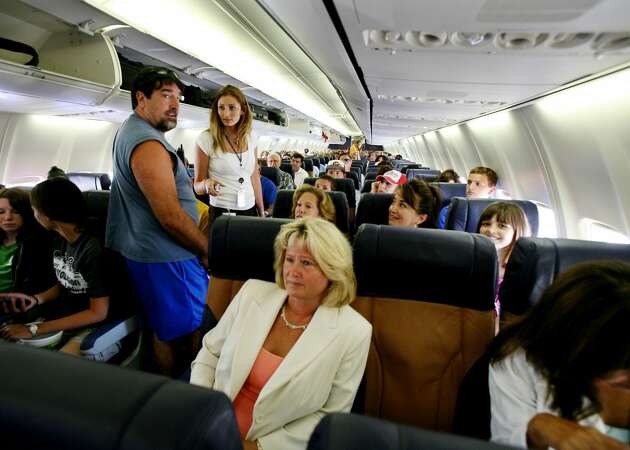 Passengers sit in their assigned seats before take-off July 10, 2006 at San Diego's Lindburgh Field Airport in San Diego, California. 