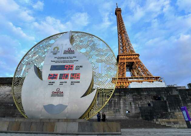 PARIS, FRANCE - APRIL 17: The official Omega Olympic countdown clock located beside the River Seine displays the remaining days until the Opening Ceremony of the Paris 2024 Olympic Games on April 17, 2024 in Paris, France. Paris will host the Summer Olympics from July 26 till August 11, 2024.