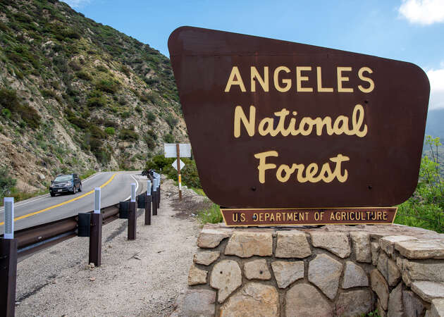 A car drives pass the 'Angeles National Forest' sign in Los Angeles, Calif. on April 24, 2024.