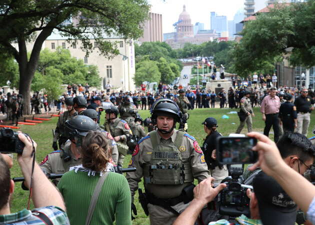 City and state officials arrested over 50 protestors at the University of Texas Wednesday. Some now cannot freely return to campus.