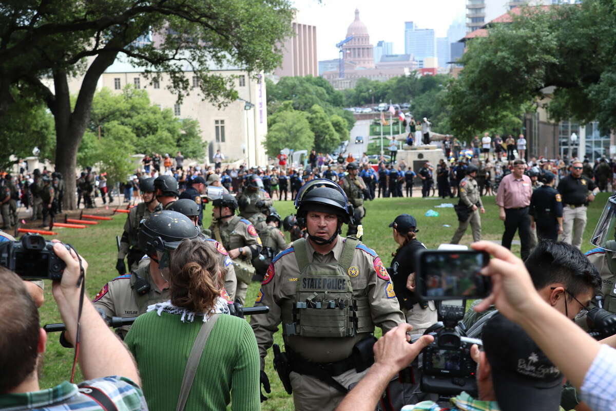 City and state officials arrested over 50 protestors at the University of Texas Wednesday. Some now cannot freely return to campus.