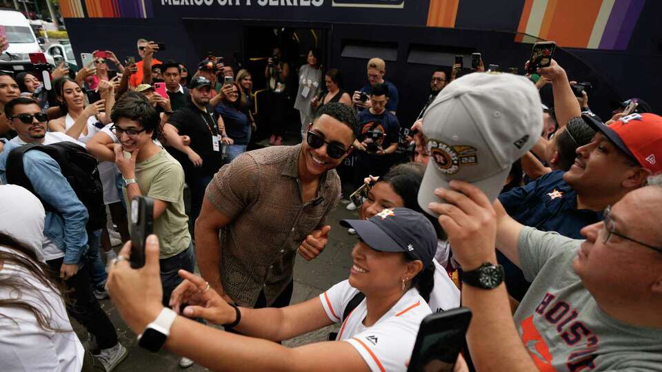 Houston Astros' Jeremy Peña poses for photos with fans during the Toco Tour promotional event at La Cibeles plaza in Mexico City, Friday, April 26, 2024. The Astros will face the Colorado Rockies in two regular season games this weekend in Mexico City. (AP Photo/Fernando Llano)