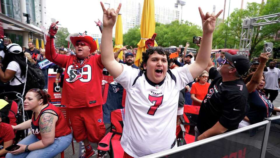 Cesar Martinez, 16, reacts with the rest of the Houston Texans fans after the Texans drafted Kamari Lassiter with the 42nd pick during the Texans 2024 Draft Party at Plaza at Avenida Houston on Friday, April 26, 2024, in Houston.