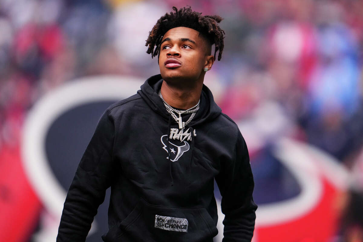 HOUSTON, TX - DECEMBER 31: Tank Dell #3 of the Houston Texans looks on from the field prior to an NFL football game against the Tennessee Titans at NRG Stadium on December 31, 2023 in Houston, Texas. (Photo by Cooper Neill/Getty Images)