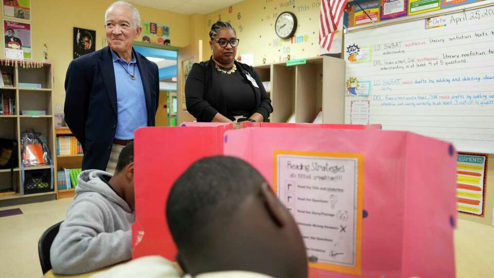 Mike Miles, HISD superintendent, left, and Erica Brame-Manuel, principal, right, are shown in a classroom at Thompson Elementary School, 6121 Tierwester St., Thursday, April 25, 2024, in Houston.