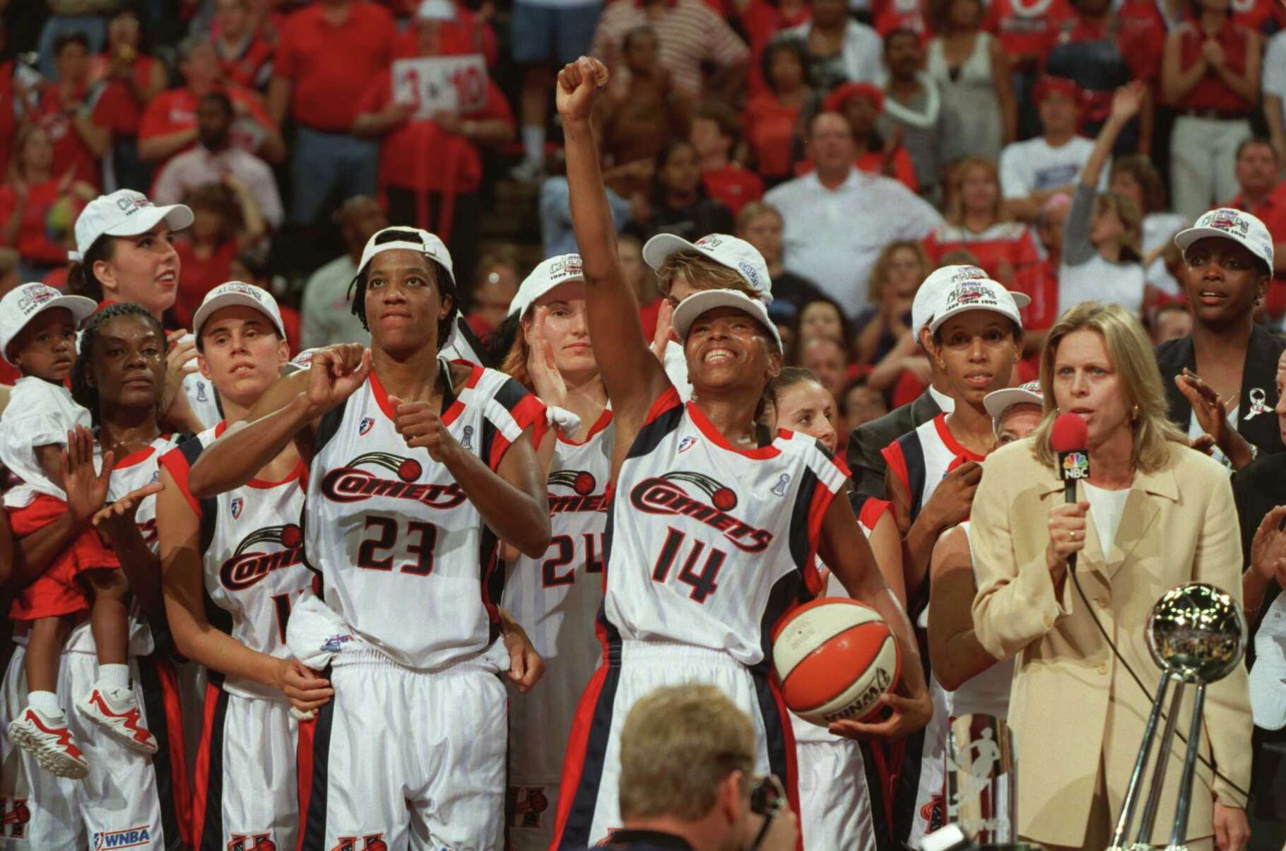 Cynthia Cooper, #14, and the Houston Comets celebrate after the Comets beat the New York Liberty 59-47 to win their third straight WNBA Championship Sunday, Sept. 5, 1999 in Houston. HOUCHRON CAPTION (09/12/1999): Simply super: After failing to win the Most Valuable Player award for the first time, Cynthia Cooper finished on top in the end as she celebrated not only the Comets' championship but being named MVP of the WNBA Finals.