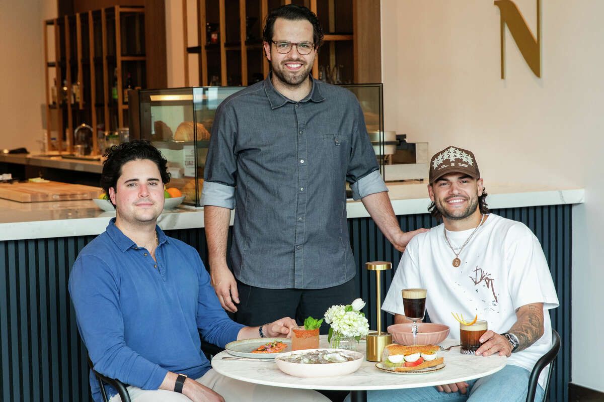 From left to right: Juan Carlos Martinez de Aldecoa, Nicolás “Nico” Baizán de Aldecoa, and Lance McCullers Jr. at Maven Coffee + Cocktails at Thompson Hotel in Houston, Texas.