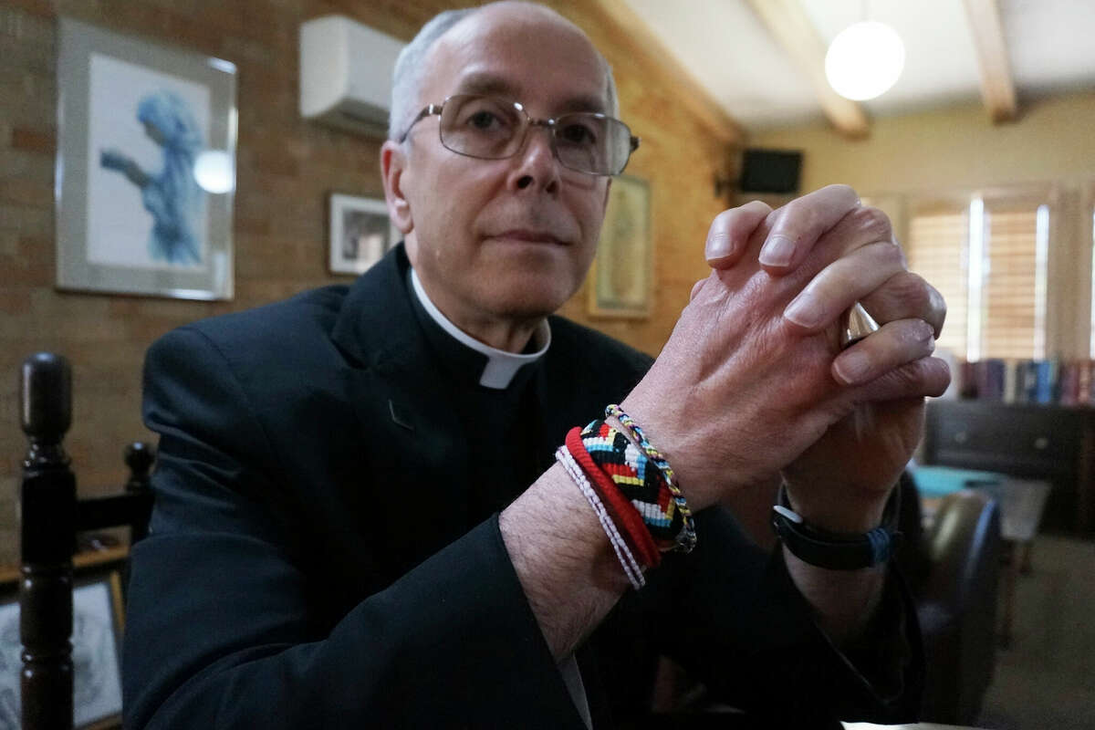 Bishop Mark Seitz of El Paso sits for a portrait in his office in El Paso, Texas, on April 4, 2022. Seitz, the Roman Catholic bishop of El Paso, Texas, tells The Associated Press that Florida Gov. Ron DeSantis' flights of migrants from the Texas border to California are 'reprehensible' and 'not morally acceptable.' DeSantis' recruiters zeroed in on Sacred Heart Catholic Church in El Paso and its bustling migrant shelter to find asylum-seekers to fly to California's capital city on Florida's taxpayer-funded jets. 