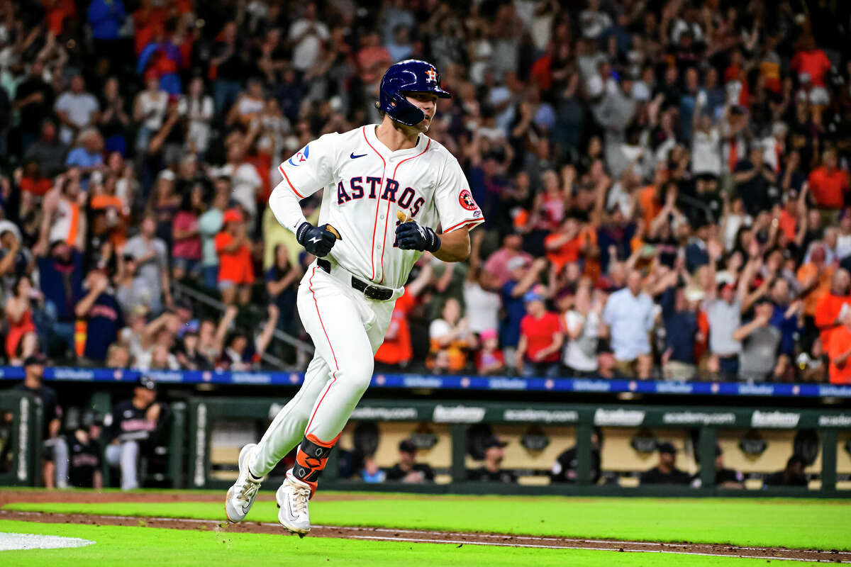 Joey Loperfido #10 of the Houston Astros hits a two-run single in the fourth inning against the Cleveland Guardians at Minute Maid Park on April 30, 2024 in Houston, Texas.