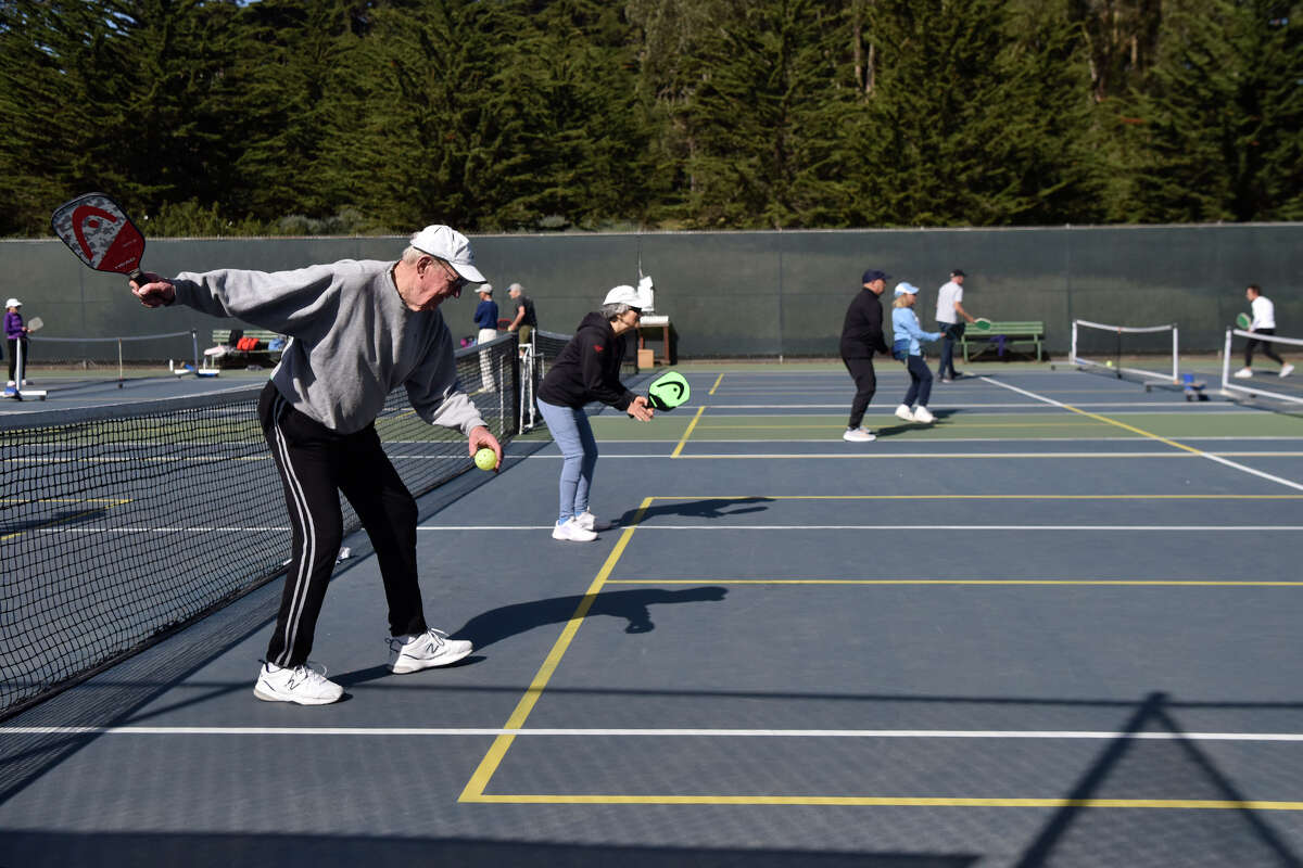 Pickleball players fill the available court at Presidio Wall Playground in San Francisco, Thursday May 3, 2024. 