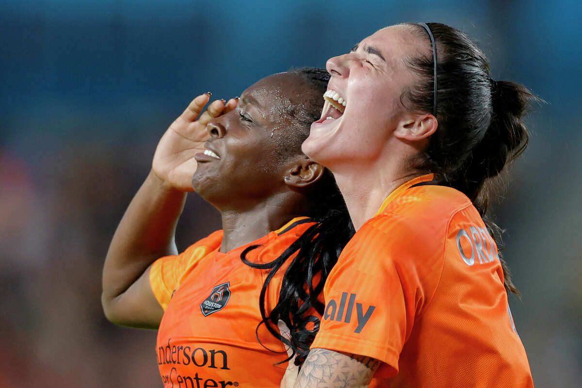 Michelle Alozie, #22 of the Houston Dash, celebrates her goal with Diana Ordonez, #11, during the first half against the Orlando Pride at Shell Energy Stadium on June 03, 2023 in Houston, Texas.