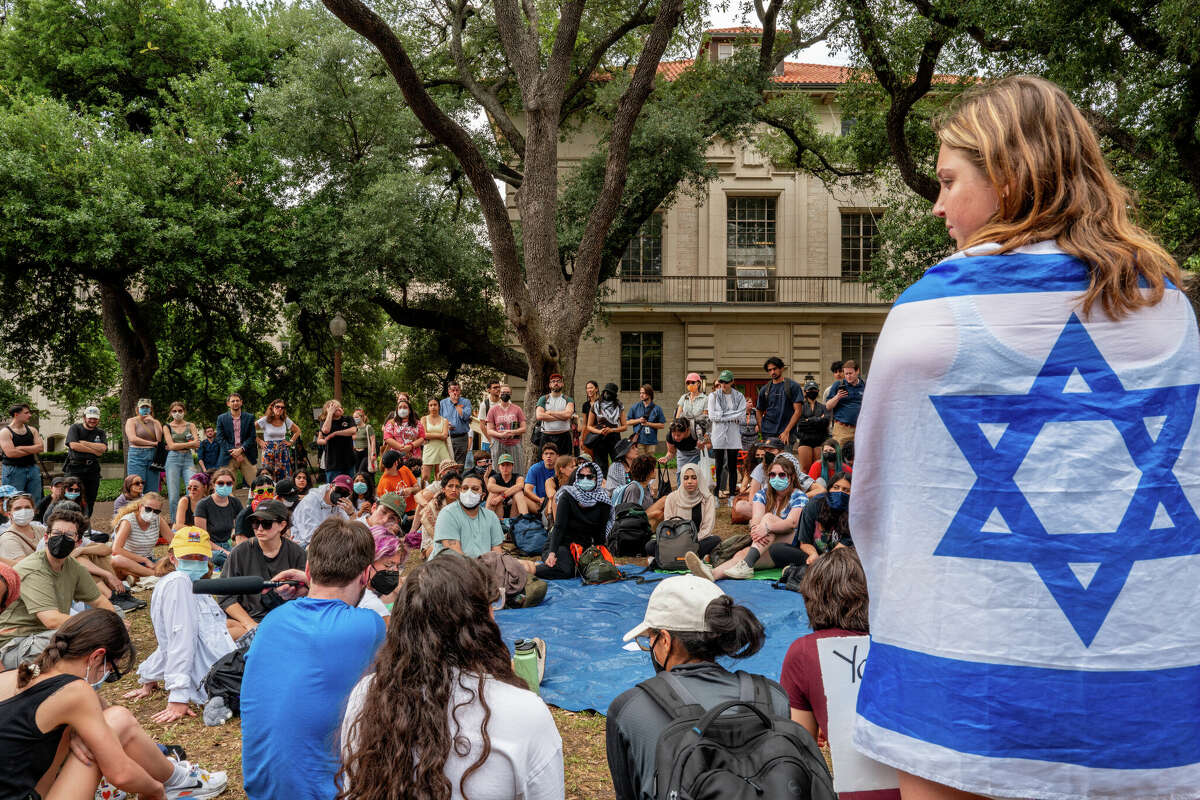 AUSTIN, TEXAS - APRIL 30: Students listen during a pro-Palestine educational rally held on campus at the University of Texas at Austin on April 30, 2024 in Austin, Texas. Professors Pavithra Vasudevan and Karma R. Chavez gathered with students to process recent events and further learn about the history of Palestine in light of the recent campus uprisings occurring around the country. Protests against the war in Gaza continue sweeping across college campuses nationwide, with more than 40 schools participating. (Photo by Brandon Bell/Getty Images)