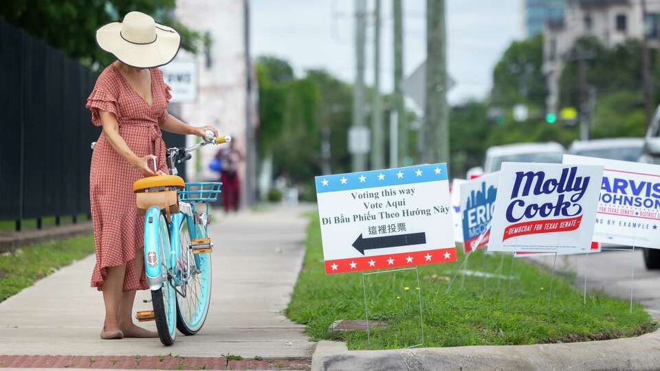 Fe Bencosme prepares to depart the Metropolitan Multi-Service Center at West Gray after voting on Saturday, May 4, 2024, in Houston.