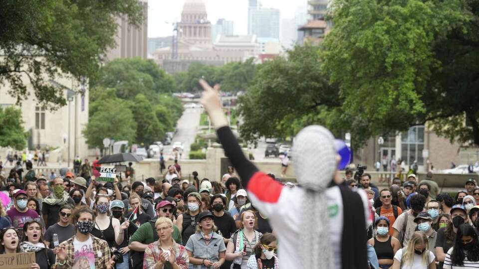 Demonstrators cheer as multiple pro-Palestine groups gathered on the campus of the University of Texas at Austin for a 'May Day' protest, Sunday, May 5, 2024, in Austin. Supporters gathered to demand the public university to pull its investment from companies the group believes are complaisant in deaths of Palestinians in Gaza and called for an end to the Israel-Hamas war. May Day, celebrated on May 1, commemorates historic struggles and gains made by workers and the labour movement.