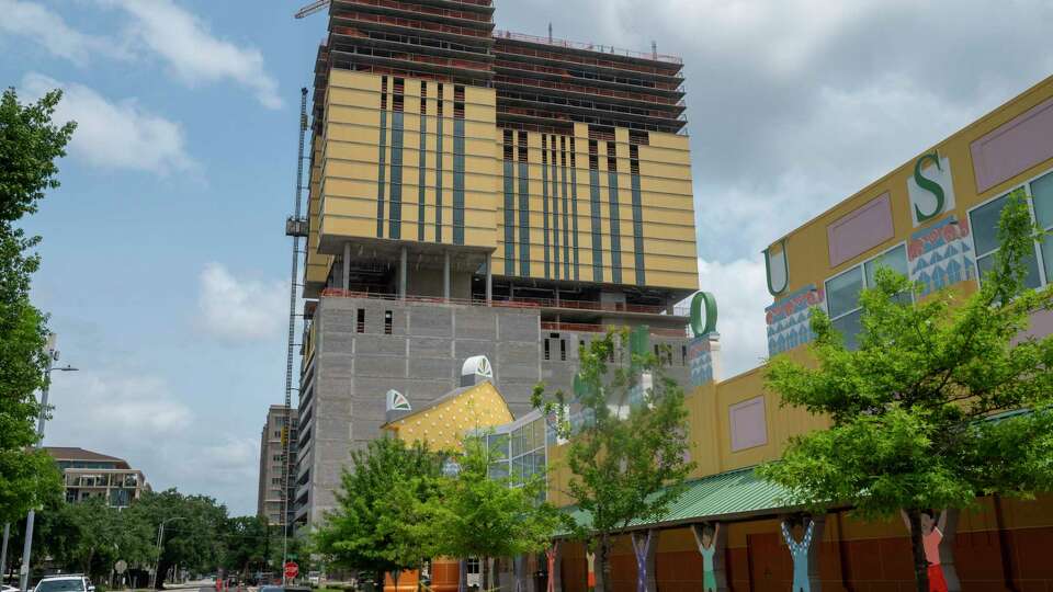 A residential tower under construction is visible adjacent to the Children’s Museum Monday, May 6, 2024 in Houston.